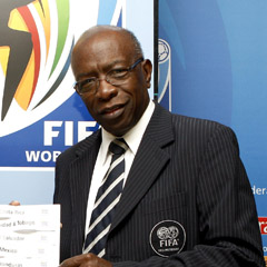 Jack Warner in front of FIFA sign